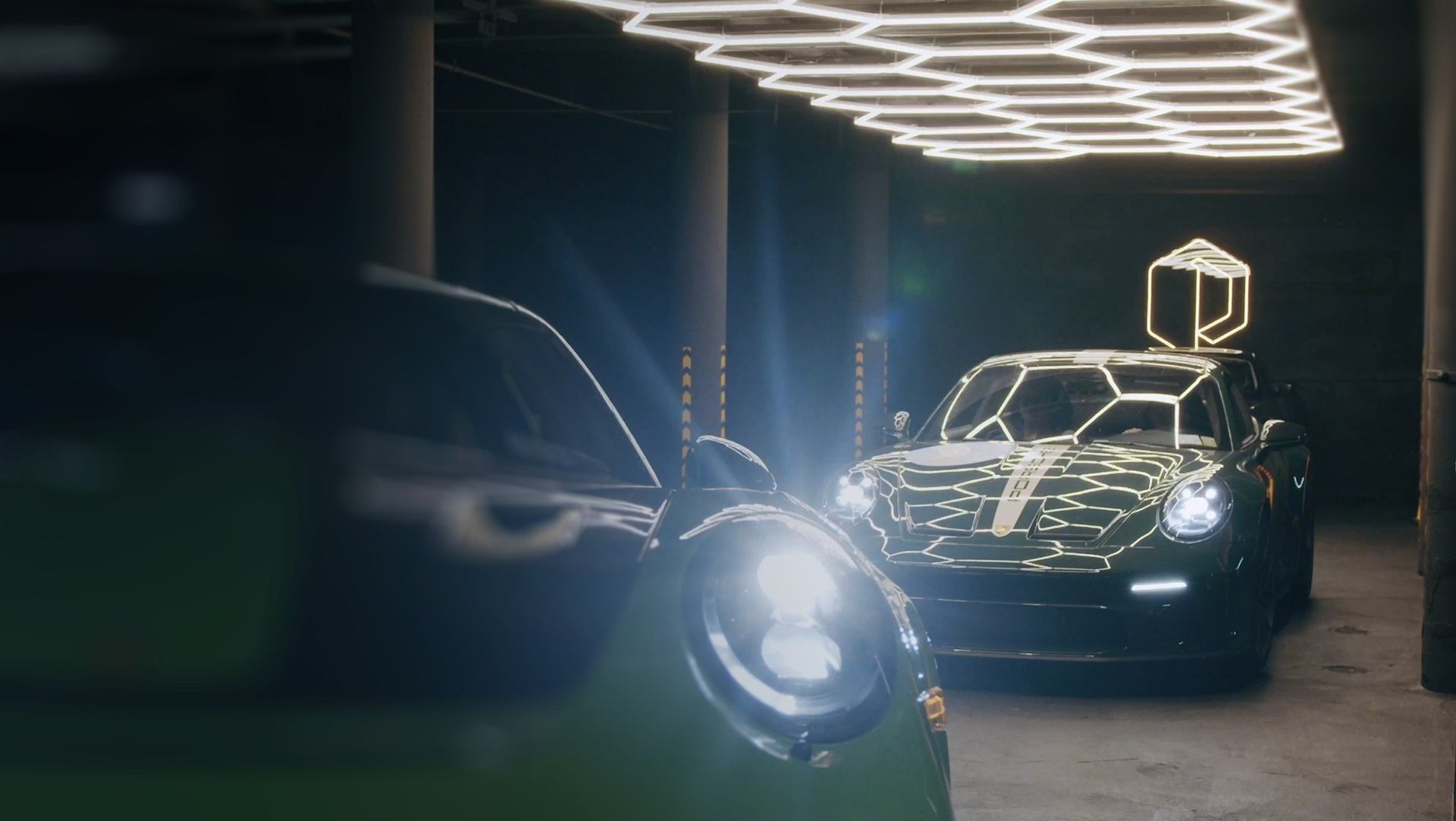 A car under Paddock's hexagonal light ceiling, the P mark above it